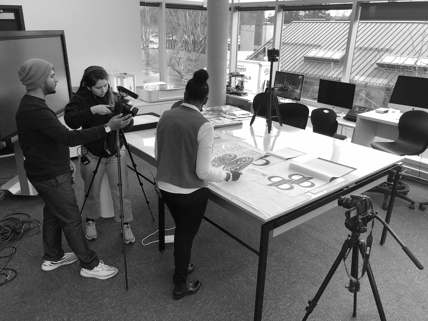 BTS birds eye photo of team and Angela